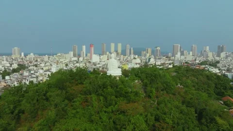 Aerial 4K view of Long Son Pagoda White Buddha statue at sunset, Nha Trang Видео 332500197