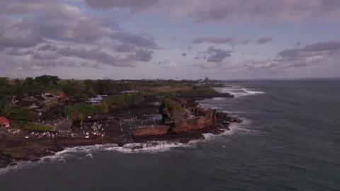 Aerial 4K view Of Sunset Beach Tanah Lot in Bali, Indonesia Stock Footage 325051932