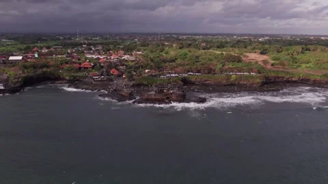Aerial 4K view Of Sunset Beach Tanah Lot in Bali, Indonesia Stock Footage 325052183