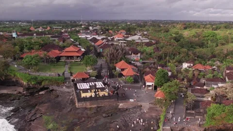 Aerial 4K view Of Sunset Beach Tanah Lot in Bali, Indonesia Stock Footage 325052404