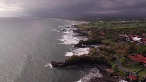 Aerial 4K view Of Sunset Beach Tanah Lot in Bali, Indonesia Stock Footage 325052480