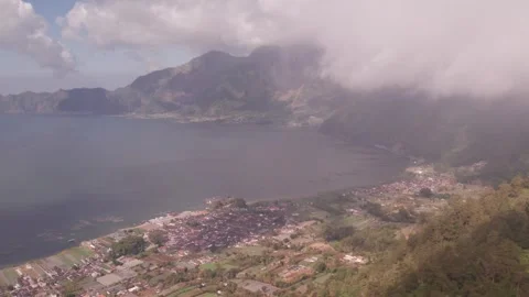 Aerial 4K view of volcano Mount Batur, Abang, Lake Batur in Kintamani, Bali Stock Footage 325387937