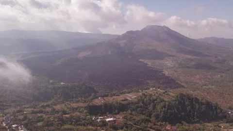 Aerial 4K view of volcano Mount Batur, Abang, Lake Batur in Kintamani, Bali Stock Footage 325387963