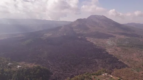 Aerial 4K view of volcano Mount Batur, Abang, Lake Batur in Kintamani, Bali Stock Footage 325388091