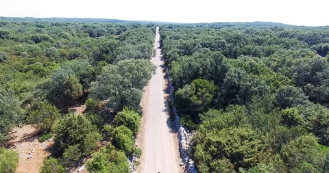 AERIAL 4K Young man doing energetic surf style turns on a skateboard Stock Footage 119492014
