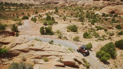 Aerial 4x4 Driving Turning Down Rocky Trail Moab, Utah Stock Footage 149694008