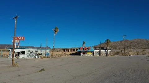 Aerial abandoned ghost town restaurant and gas station Halloran Springs 4K Stock Footage 99721441