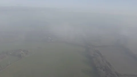 Aerial above clouds and fields in England Stock-Footage 101718252