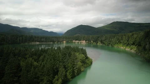 Aerial above Cowlitz River in Cispus Washington with turqoise milky water Stock Footage 339304359