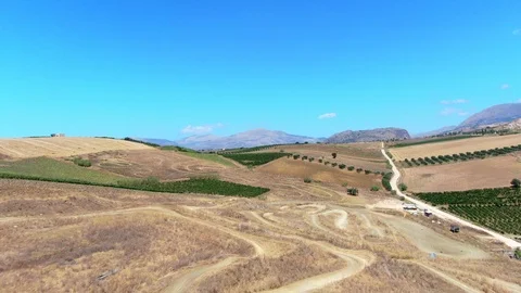 Aerial above dry patchwork crop fields in sicily, italy in summer Stock Footage 124470069