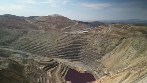 Aerial above large open copper mine in Santa Rita New Mexico Stock Footage 332139976