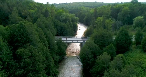 Aerial Above Nice River Forest Valley Passing Over Rural Bridge Late Afternoon Stock Footage 200046559