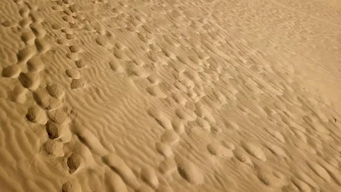 Aerial above sand dune pattern at the desert. Fly over desert landscape with Stock Footage 145533427