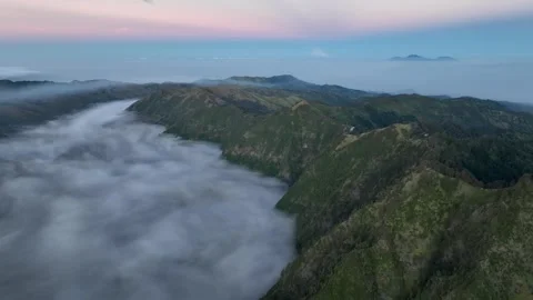 Aerial Above Sea of Clouds at Mount Bromo Volcano Sunrise, East Java, Indonesia Vídeos de archivo 341857231