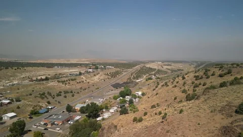 Aerial above small town of Eureka Nevada in Great Basin desert on hazy day Stock Footage 316802289