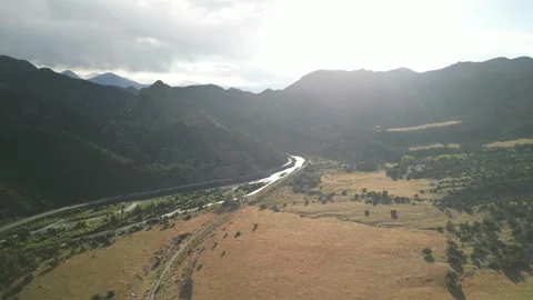 Aerial above train track next to Arkansas River near Cañon City Colorado Stock Footage 286242018