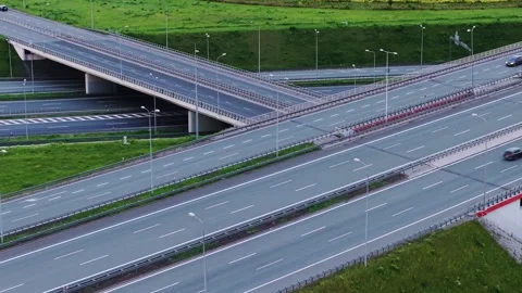 Aerial abstract pull back shot of large A1 A4 highway interchange Vidéo 342437385