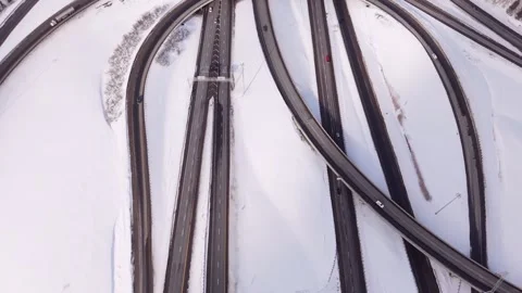 Aerial abstract road network pattern in snowy winter landscape Stock Footage 328963142