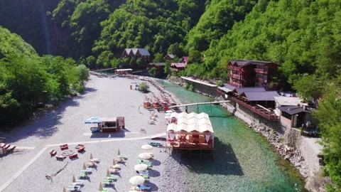 Aerial of accommodations beach area at Shala river in Albania Stock Footage 342537905