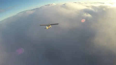 Aerial airplane cloud chase over sun lit cloud layer Stock Footage 237883282