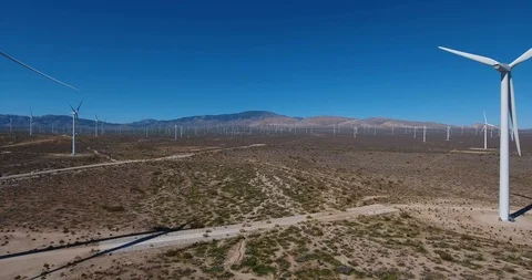 Aerial along windmill in desert Video stock 104813053