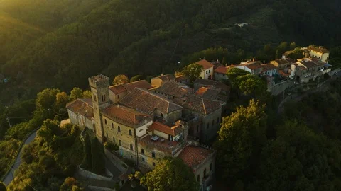 Aerial, an ancient small perched hamlet on sunset in Tuscany, Italy Видео 100704336