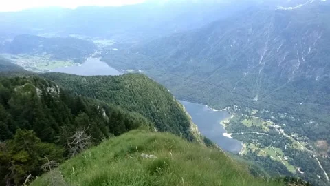 Aerial and high angle view on Bohinjsko jezero, Lake Bohinj and Stara Fuzina Stock Footage 150434816