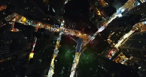 AERIAL. Animation of Drone Multi-rotor flying above the city panorama at night Stock Footage 86211985