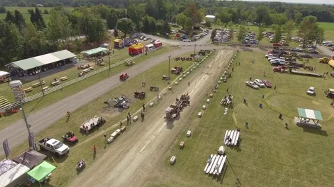 Aerial antique tractor pull low fly by 4k Stock Footage 81235809