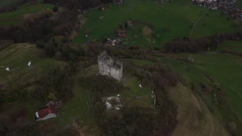 Aerial Approach and Top Down View Over Ruined Castle in Alpine Landscape Stock Footage 331742693