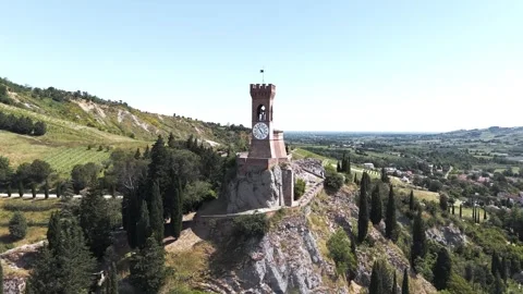 Aerial approach and top-down view of medieval clock tower, Brisighella Stock Footage 338258794