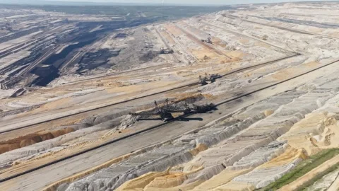 Aerial approach excavator machine in open pit lignite coal mine Stock Footage 332476996