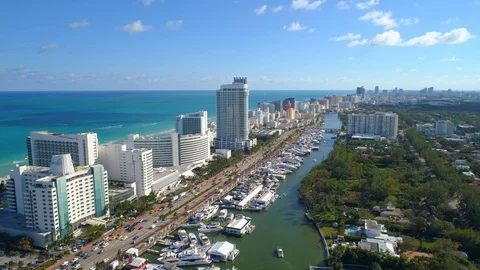 Aerial approach flyover and tilt down camera Miami Beach Fontainebleau Hotel  Stock Footage
