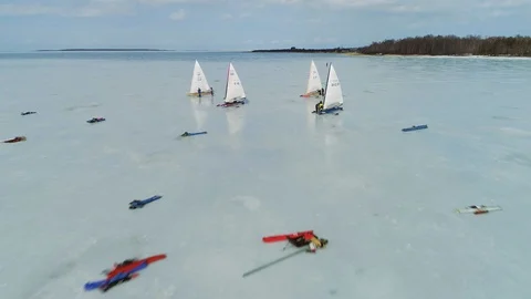 Aerial approach over Monotype-XV class ice yachts preparing for race Vidéo 88201601