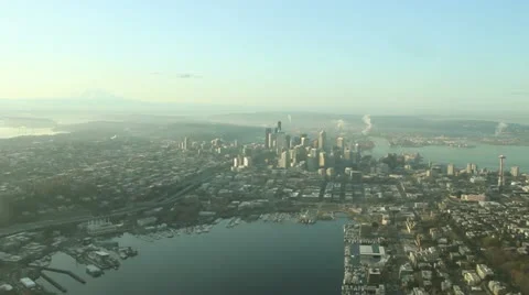 Aerial Approach to Seattle and Space Needle on Calm, Smoggy Day Stock Footage 10991453