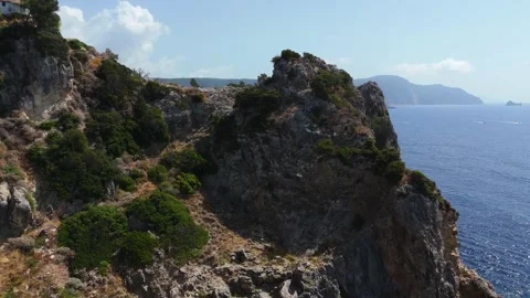 Aerial Approach Toward Steep Mediterranean Cliffs Overlooking Deep Blue Sea Stock Footage 315073789