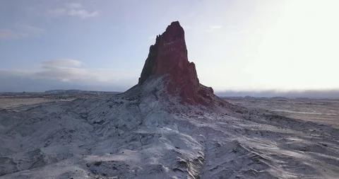 Aerial approaching dramatic volcanic mountain in a snowy desert landscape Stock Footage 106482891