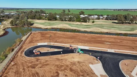 Aerial approaching a road construction crew with two road rollers and a pav.. Stock Footage 279355071