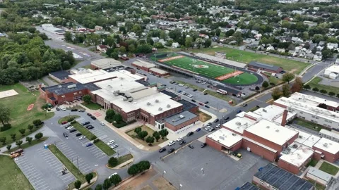 Aerial approaching shot of american high school stadium of West Virginia Vídeos de archivo 319987765