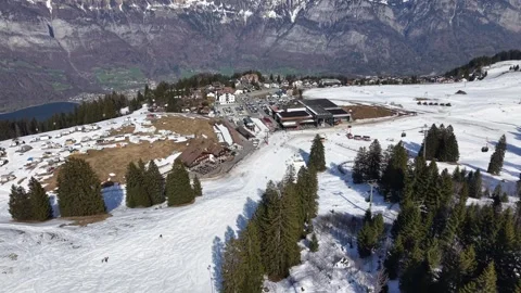 Aerial Approaching Ski Resort Base With Parking Area and Melting Snow 스톡 동영상 331095676