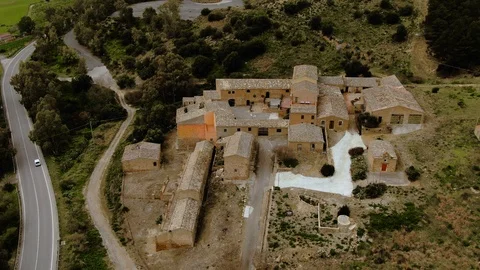 Aerial approaching view of an abandoned rural village in Sicily Stock Footage 105682678