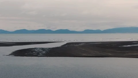 Aerial approaching view of a black sandy beach in North Iceland Stock Footage 116184636