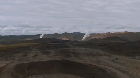 Aerial approaching view of geothermal plants in a volcanic area in North Iceland Stock Footage 116545729