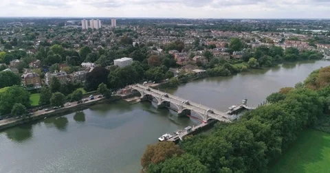 Aerial approaching view of a lock on the river Thames at Richmond, West London Stock Footage 80613017
