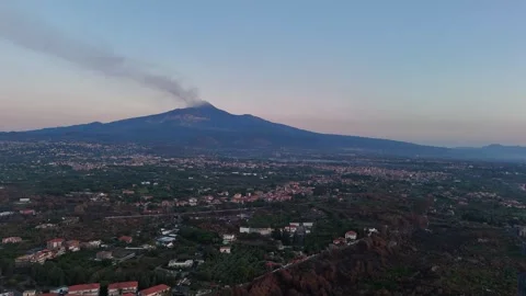 Aerial approaching view of Mount Etna in Sicily with smoke from the crater Stock Footage 283964768