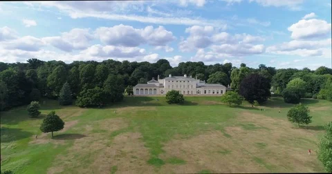 Aerial approaching view of a neo classic country house in North London Stock Footage 77972336