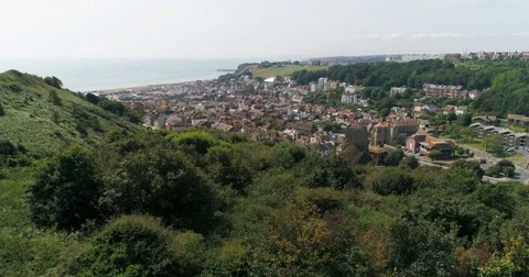 Aerial approaching view of the old town of Hastings in England and the beach Stock Footage 80410315