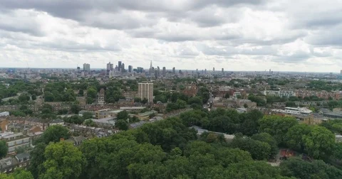 Aerial approaching view of the skyline of central London from a park Stock Footage 79656377