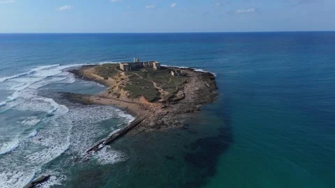Aerial approaching view of the small island Isola delle Correnti near Portopalo Stock Footage 301315960