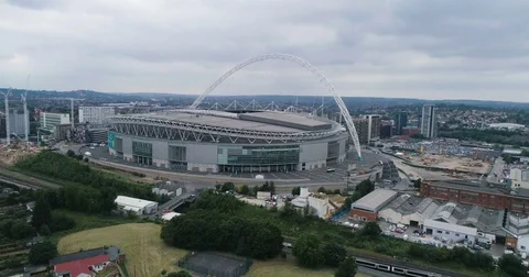 Aerial approaching view of Wembley stadium in North London Stock Footage 77566626